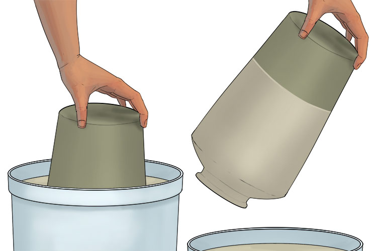 Now dip your leather hard pot into your slip. Depending on the design you would like for your pot you can either fully submerge it to cover the whole pot, or partially submerge it to only cover a portion of the pot in slip