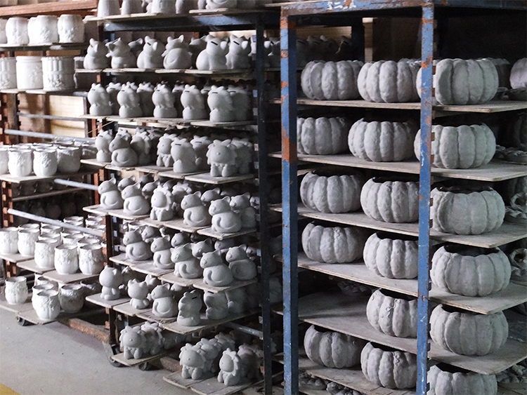 In the picture below it shows lots of greenware pieces, all waiting to be fired glazed and fired.