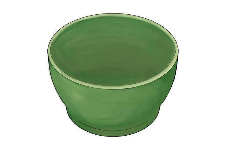 You should start slip decorating your bowl when it is leather hard. We've started by painting on an even layer of green slip across our all of our bowl. Like most forms of paint, you will need to leave your first layer to dry before adding any more colour