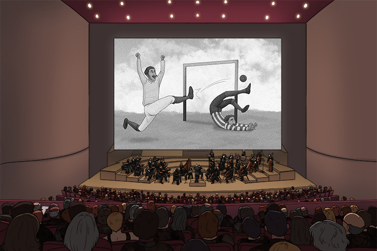 The silent movie showed someone scoring (score) a goal, and the live orchestra accompanied this with a musical composition written specifically for the film.