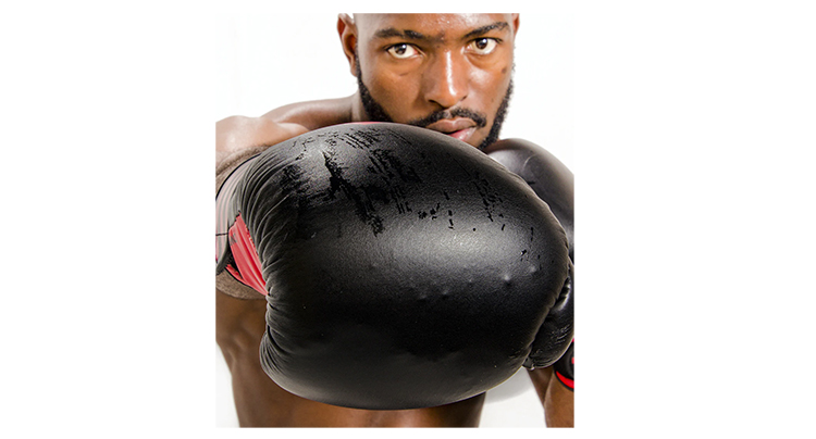 In this image of a boxer, his fist is that close to the viewer, it appears larger than his head.