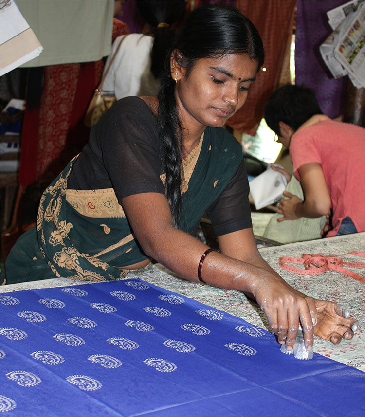 "File:Woman doing Block Printing at Halasur village, Karnataka.jpg" by Anne Roberts is licensed under CC BY 2.0.