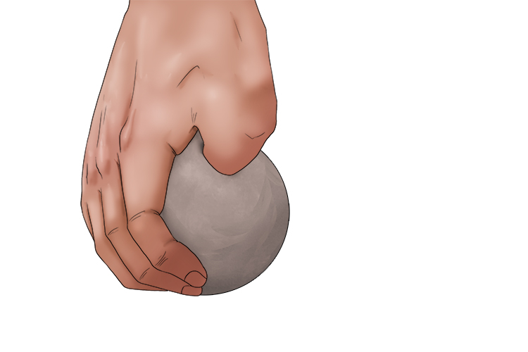 Push your thumb into the clay until you reach just further than half way through.