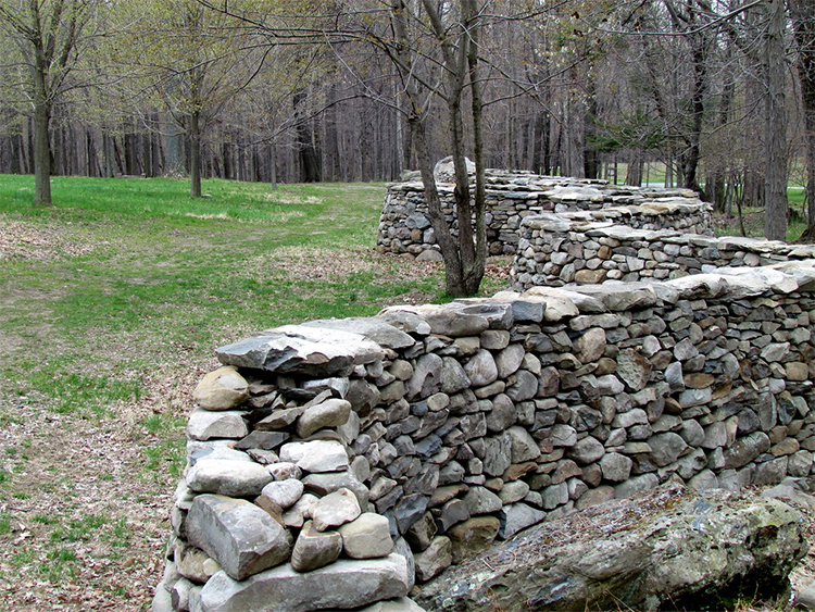 "Andy Goldsworthy Five Men, Seventeen Days, Fifteen Boulders, One Wall Storm King Art Center NY 2619" by bobistraveling is licensed under CC BY 2.0.