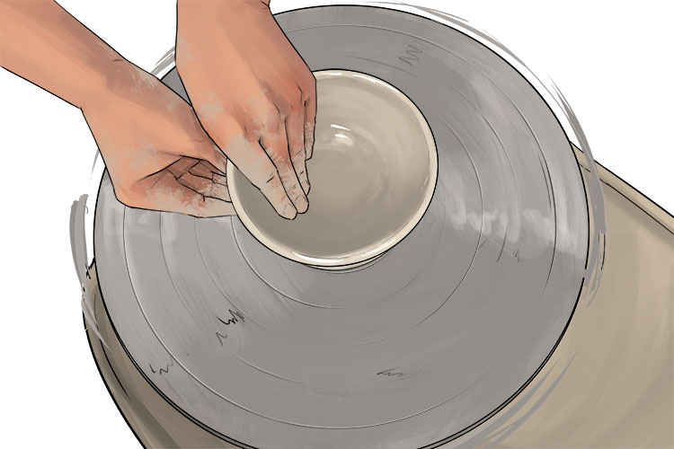 Next you are going to pull the sides of the bowl out. With one hand inside the bowl and one outside, push from either side of the clay while moving your hands from the bottom to the top of the bowl. You should be gradually easing off how much pressure you