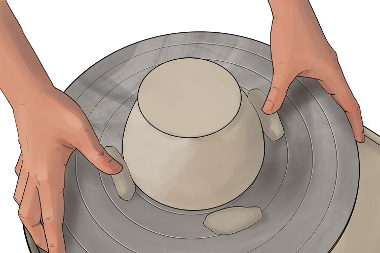 secure the bowl in place using four evenly spaced chunks of clay pressed onto the surface of the wheel. Make sure not to press them into the bowl as these are only to hold it in place so shouldn't be attached