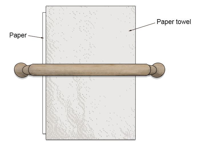 Place the paper on top of the ink topped plate. Put another sheet of paper towel over the whole thing and use a rolling pin to apply constant pressure across the surface.