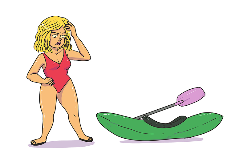A woman  in a red swimsuit looking at a kayak 