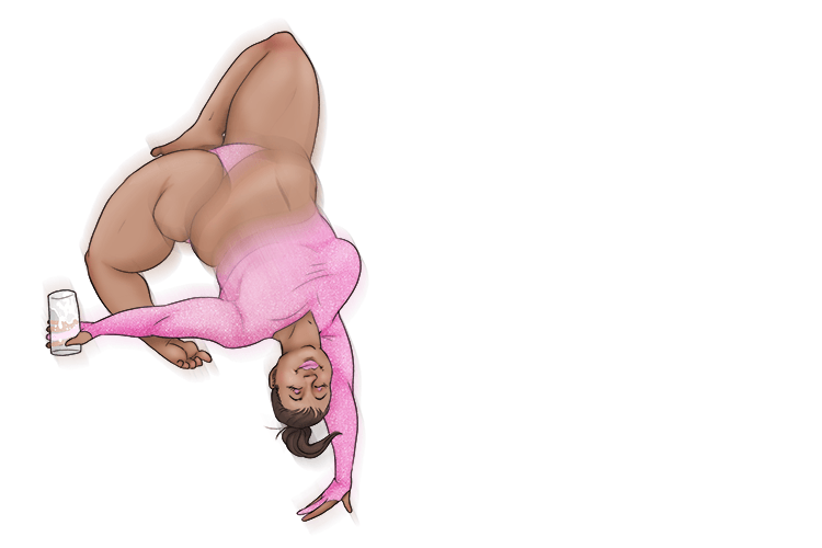 Her tummy was a blur (tumbler) while the acrobat performed somersaults holding a drinking glass with straight sides.