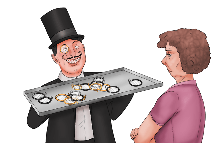 I showed her all the monocles that I had on a tray (montrer).