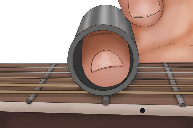This is a top-down view of a slide placed on the strings. It does not need to be pressed into the frets as the finger normally would, but glides over them while in contact with the strings.